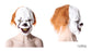 Front and side views of a scary clown mask with a white face, orange hair, dark facial markings and yellow teeth.