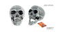 Front and angled views of a grey and white skull decoration, showing its jaw closed and open.