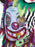 Close-up of lenticular clown eyeballs, mesh collar and green handprint detail on costume top