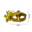 Two women wearing gold carnival masks at celebration with confetti