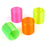 Four neon rainbow spring toys in pink, green, orange and yellow on white background