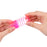 Hands stretching a pink neon rainbow spring toy