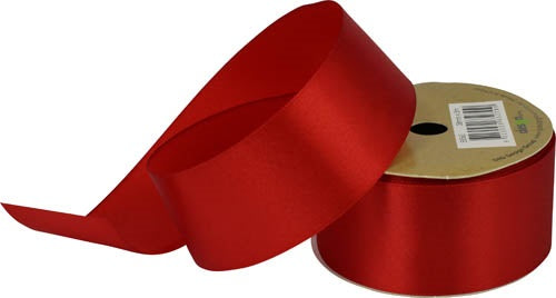 Wide red satin ribbon on a gold-coloured spool with a loose length displayed