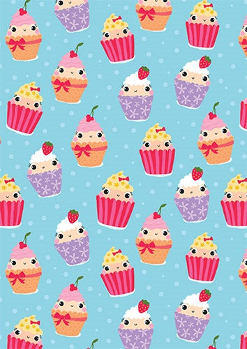 Light blue folded gift wrap featuring smiling cupcakes in pink, purple and orange cases