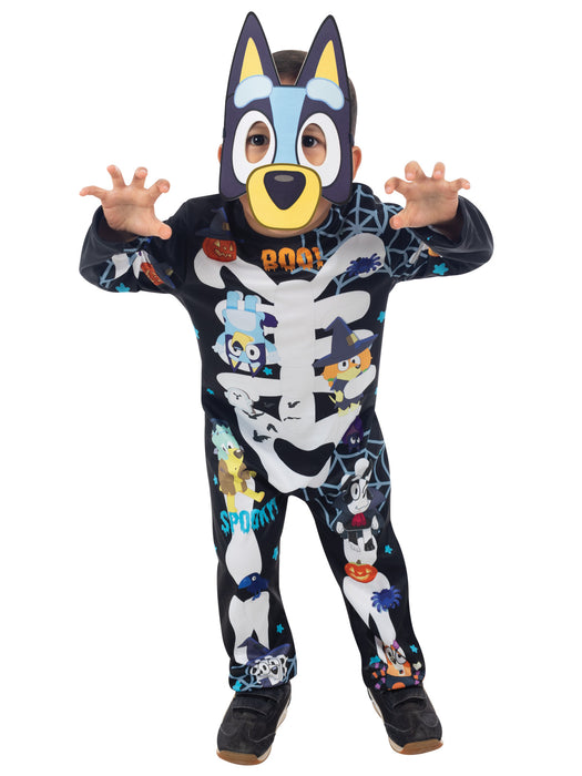 Child posing in Bluey Halloween jumpsuit with bones, pumpkins and character print and Bluey mask