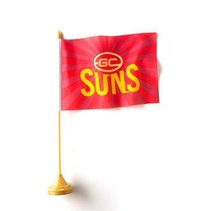 Gold Coast Suns red AFL desk flag with yellow Suns design on a gold-coloured pole and base