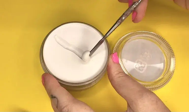 Applying Global Colours Clown White cream makeup from the 75g pot