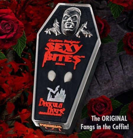 Sexy Bites fangs in coffin-shaped packaging surrounded by red roses.
