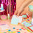 Colour Mill Flexi Scraper lifting a rectangular decorated cookie