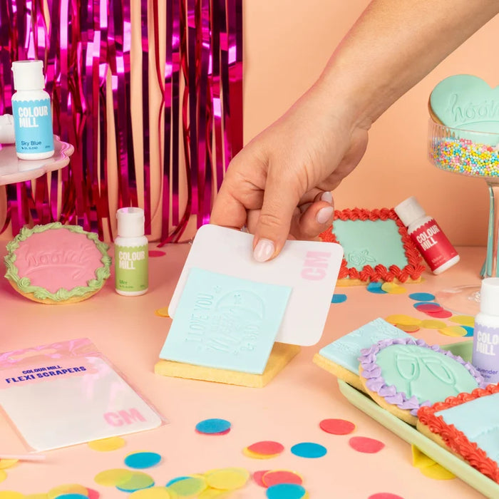 Colour Mill Flexi Scraper lifting a rectangular decorated cookie