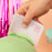 Colour Mill Flexi Scraper smoothing green icing on a cake