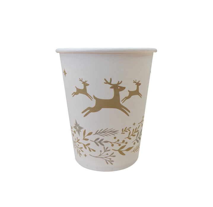Christmas paper cup with gold leaping reindeer and gold and silver foliage on a pale background