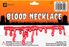 Red dripping fake blood necklace in JD Party Halloween costume accessory packaging.