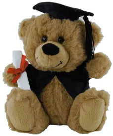 Brown graduation teddy bear wearing a black cap and vest and holding a rolled diploma tied with a red ribbon