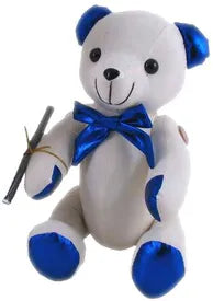 White autograph bear with shiny blue ears, paw pads and a matching blue neck bow