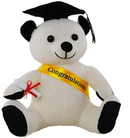 Small white graduation autograph bear with black cap, yellow congratulations sash and rolled diploma tied with red ribbon